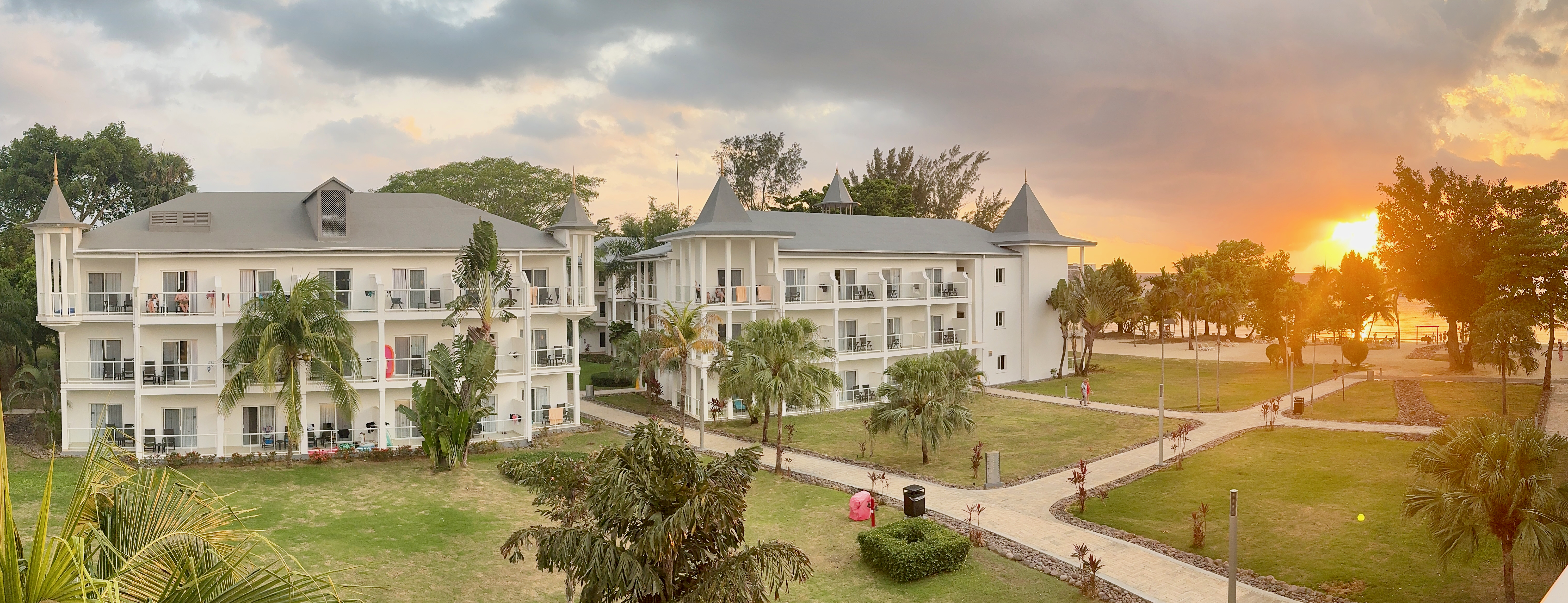 Sunset over the gardens and buildings of Riu Palace Tropical Bay in Negril, Jamaica